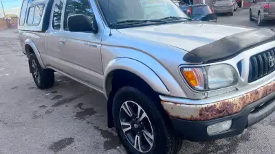 Looking for a dependable truck that's ready to work or tackle your next adventure? This 2004 Toyota...