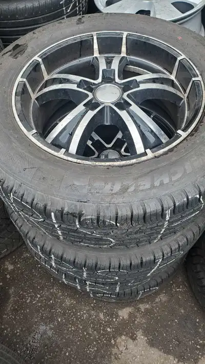 Selling an 18 inch rims with 245 60 18 michellin summer tires almost brand new... just need a little...