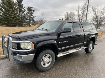 Dodge Ram crew cab 4x4 2500 short box 5.9L Cummins pre emissions. 4” exhaust with muffler and dual e...
