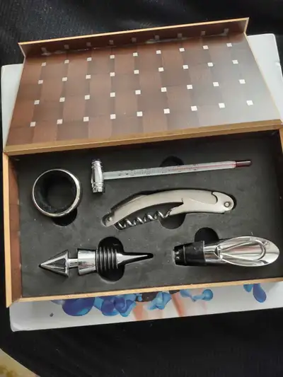 Enhance your wine experience with this comprehensive wine tool set, complete with a bottle opener, t...