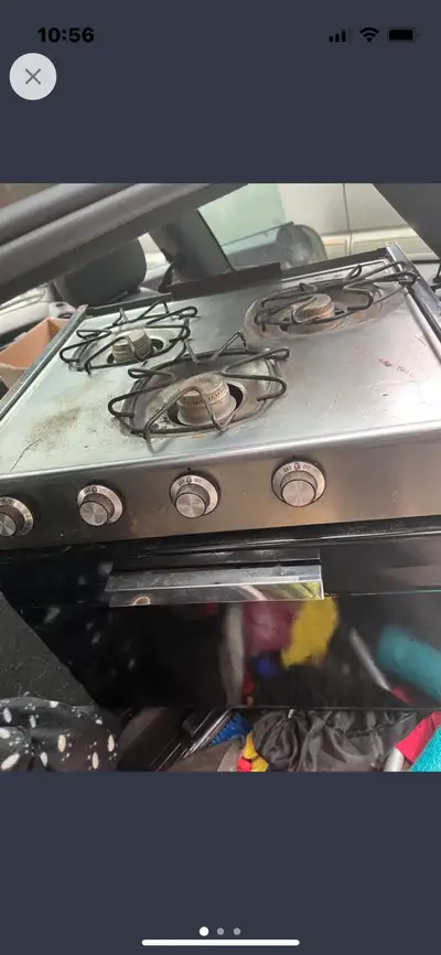 3 burner RV stove. Comes with a built-in oven. Worked perfectly when it was removed from the trailer...
