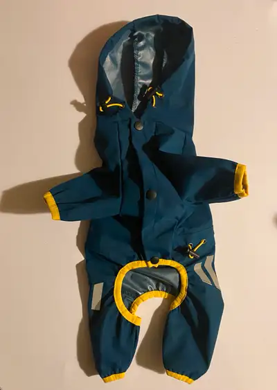Joyful Pattern Pet Supplies. Blue waterproof raincoat. Size medium. Hooded. Leash hole. Reflective s...