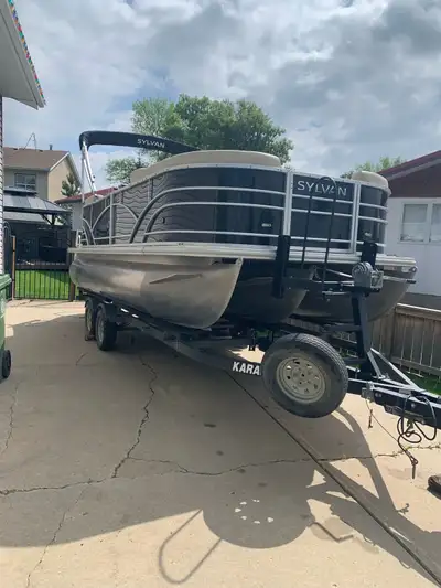 20Ft Poonton with 115 Mercury motor with tow bar. Fish finder. Excellent shape. 300 hrs on the motor...