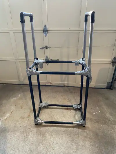 Tire storage rack to hold 4 tires. Extended both sides as well as top/bottom with 2" spacers. Tape a...