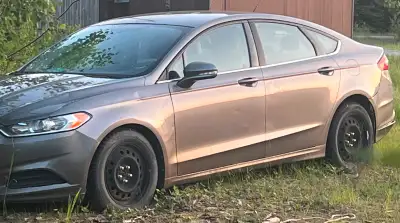 For sale 2013 Ford Fusion 5500$ as is O.B.O