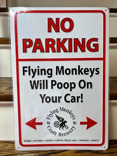 Add a quirky touch to your space with this "Flying Monkeys Will Poop On Your Car!" sign. This novelt...