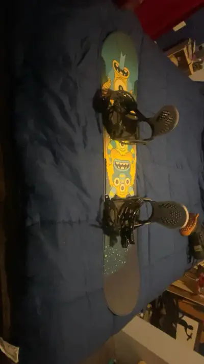 Snowboard with size 7 boots for the board.