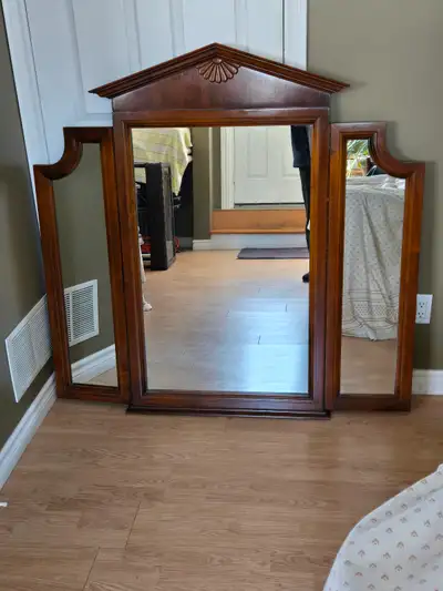 This beautiful side folding vanity triple mirror has a rich color real solid wood frame Like new con...