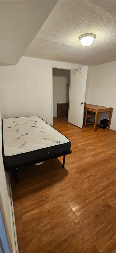 Fully furnished shared room in basement for boys - At Airport and Thamesgate Rd - Utilities included...