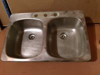 Stainless steel double bowl sink.