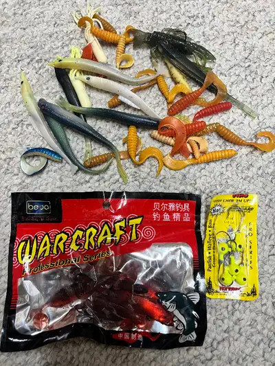 For sale various new and used fake baits and fishing line spool. _Brand new bag of red fake fish bai...