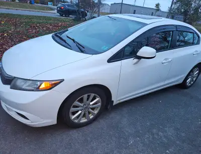 This 2012 Honda Civic EX is a reliable and efficient sedan, perfect for daily commuting or city driv...