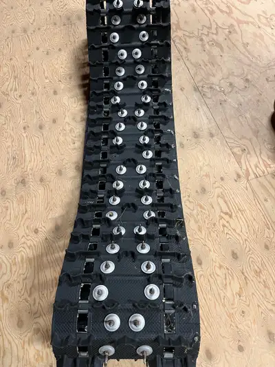 137 track from a 2016 skidoo renegade. Studded. No pull throughs. A few torn lugs. $125
