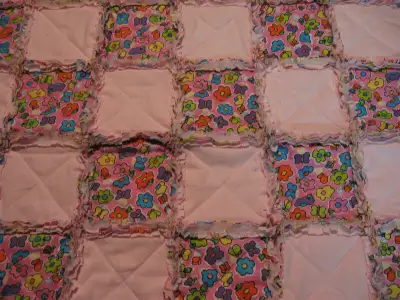 Brand new flannel rag quilt, with baseball, and cloud print fabric. Made of three layers of flannel....
