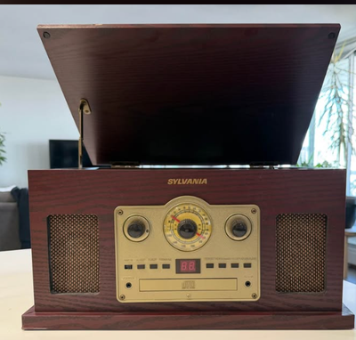 Sylvania Nostalgia 5-in-1 turntable radio in great condition. If it’s posted it’s available Located...