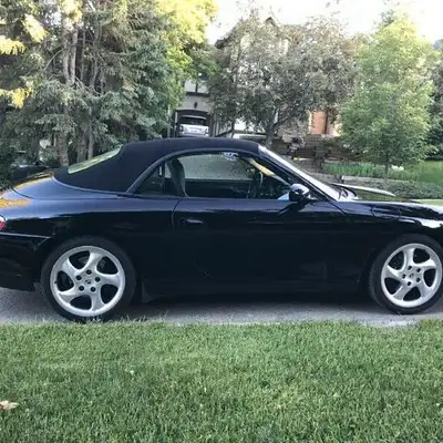 Check out this sleek, pre-loved 2000 Porsche 911 Carrera convertible, a true sports car that deliver...