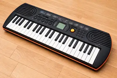 Casio SA 76 with power adaptor, View more