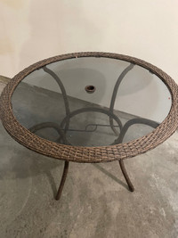 Outdoor round all weather wicker dining table. One year old. 