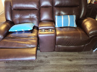 1 year old Leather loveseat and couch reclining.