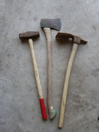 Vintage set of old tools.  Adze, sledge hammer and axe