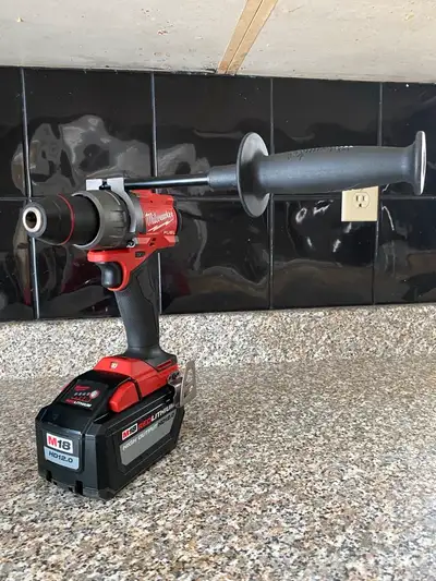 MILWAUKEE FUEL 18 BRUSHLESS HAMMER DRILL AND 12 AMP BATTERY, View more