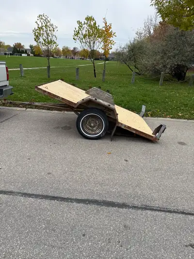 Tilt trailer for quad, snowmobile, hunting etc. Heavy steel trailer, 7 leaf springs, new deck, new w...