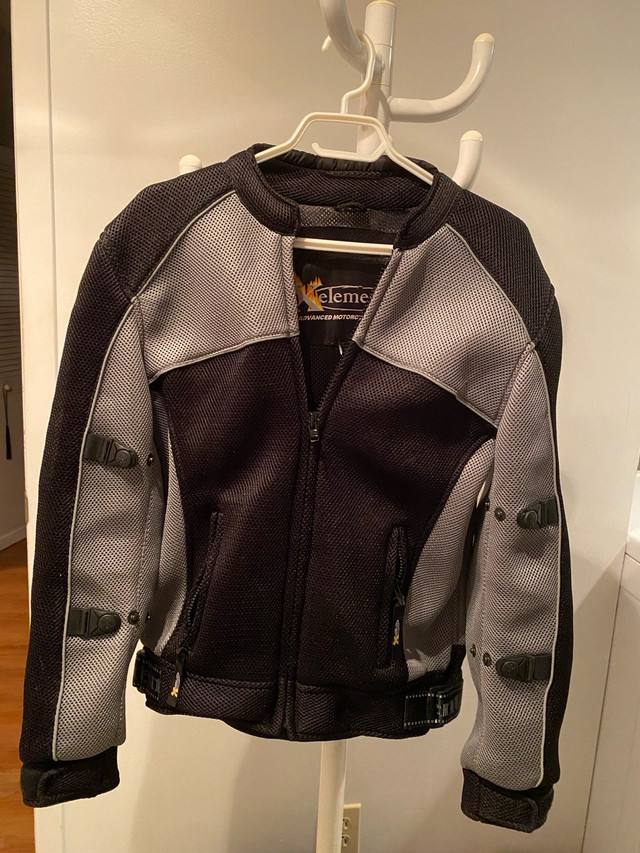 Manteau moto Xelement médium  dans Femmes - Hauts et vêtements d'extérieur  à Laval/Rive Nord