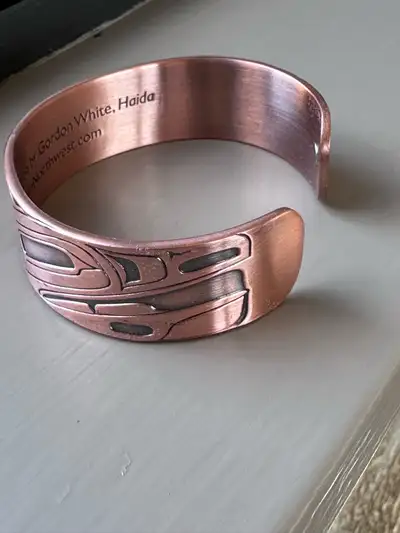 Raven & Moon copper bangle by Gordon White, Haida, View more
