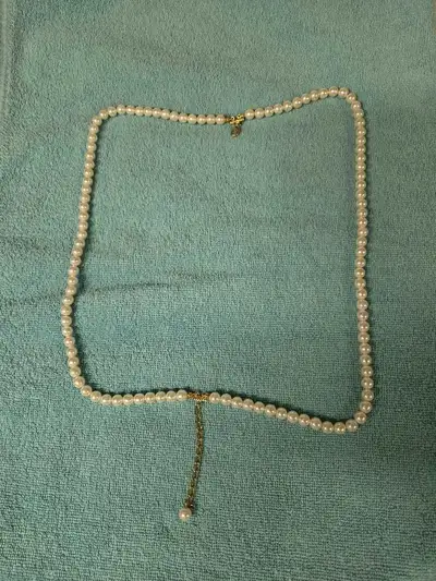 Also referred as Opera or Rope length, featuring a gold plated chain and a single pearl drop pendant...