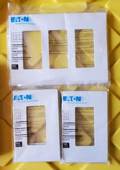 Lot of 3 Eaton screwless plates, View more