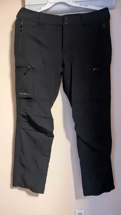 Get ready for your next adventure with these Eddie Bauer black pants, perfect for hitting the slopes...