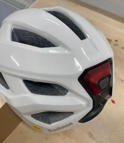 Deluxe Bike Helmet, with totally adjustable strap and rear red taillight. Brand new, two available....