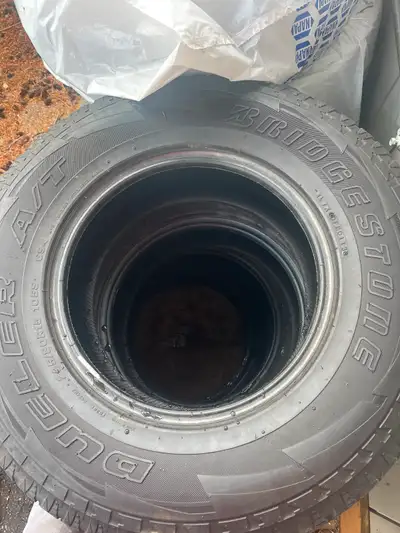 Bridgestone Dueler A/T 225/80R15 105S tires. Made in Japan. All terrain tires. Good for all seasons....