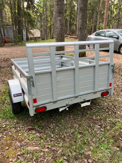 5x7aluminum utility trailer with fold down ramp with toolbox rated for 2000 lbs used only 4 times ca...