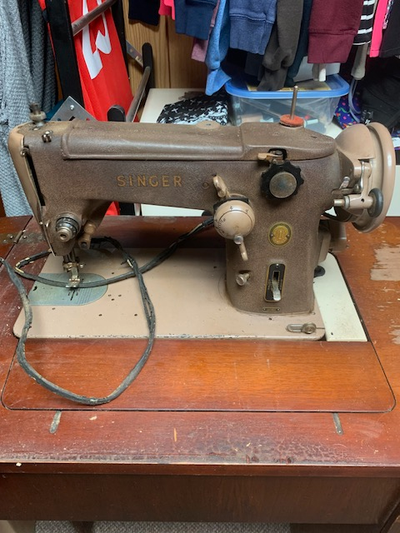 Antique Singer Sewing Machine in Cabinet Don't know much about it - looking for reasonable offer Loc...