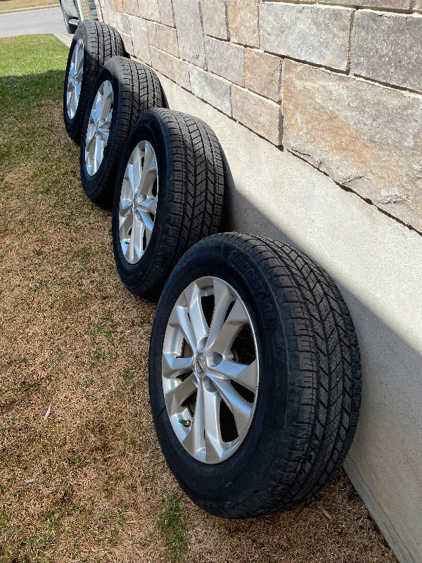 Bridgestone Tires on OEM Nissan Alloy Rims in Tires & Rims in Kingston