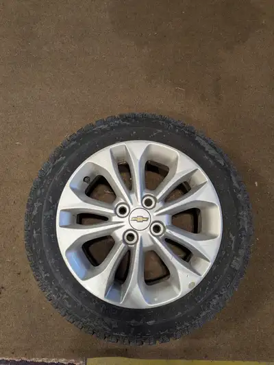 set of 4 chevy spark OE alloy wheels with studded winter tires and sensors and weathertech floor mat...