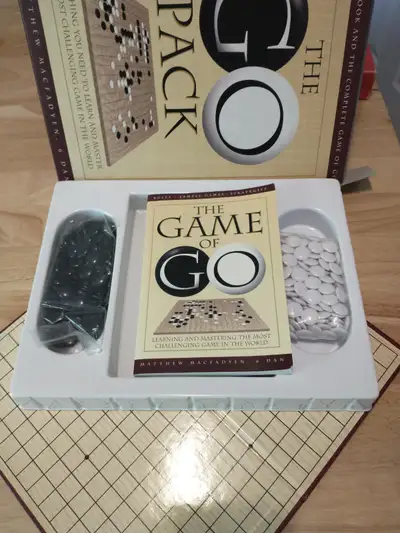 Go is an abstract strategy board game for two players in which the aim is to fence off more territor...