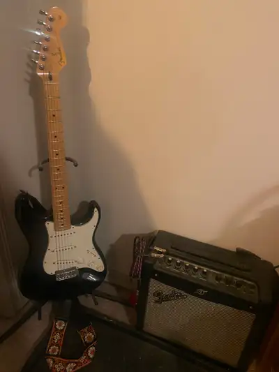 Fender Strat, amp, and guitar stand.  Package deal $900., View more