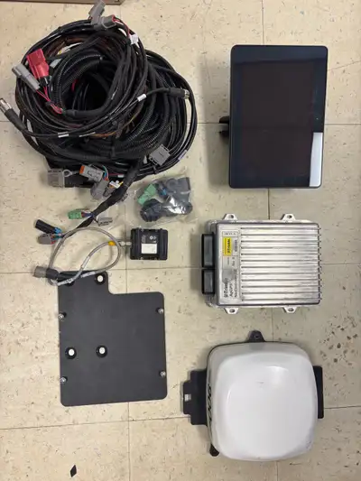 Trimble Autopilot System with a XCN1050 display, NAV900 and NAVIII. Came out of a Versatile 520 fact...