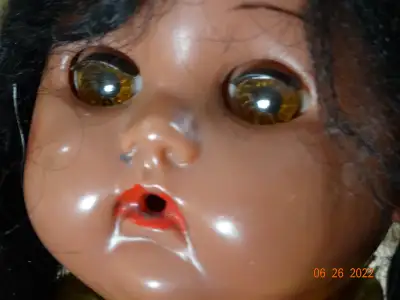 This hard plastic brown skinned girl goes well with the boy doll I have listed. Cute pair. 11 inch a...