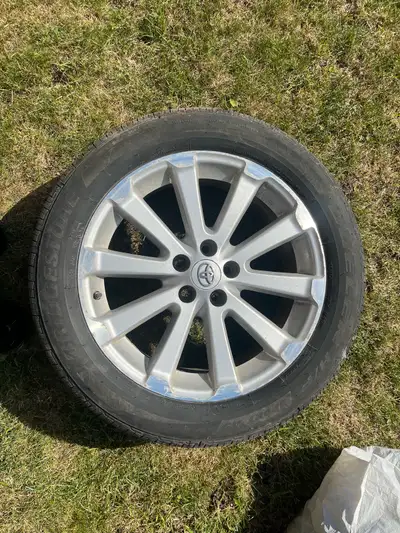 I am selling a set of four used Bridgestone all season tires (with rims attached) in very good condi...