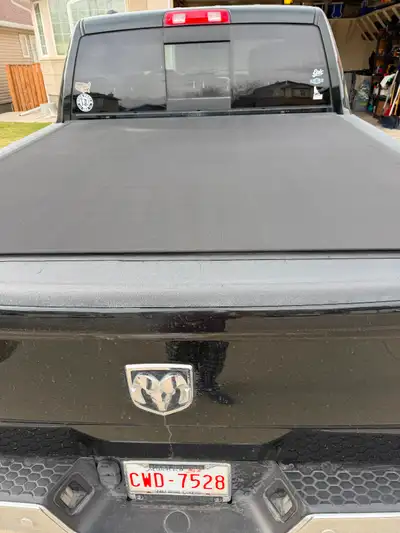 Installed last fall. This is the hard roll up tonneau cover. Asking $1000 or send an offer. Thank yo...