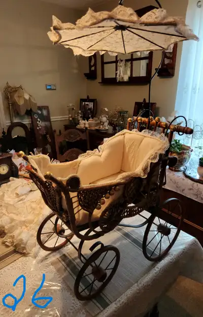 Wicker pram or stroller with umbrella for collectable dolls. Asking $75.00 or reasonable offer. Cash...