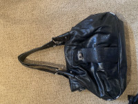 Assorted black handbags