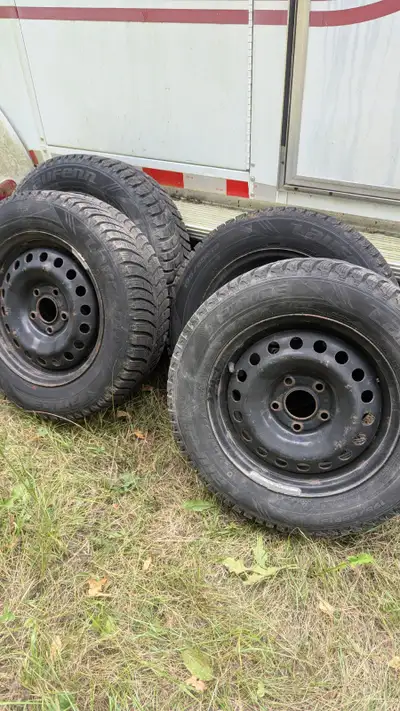 For sale is a set of four winter tires mounted on steel rims, size 195/65R15, perfect for providing...