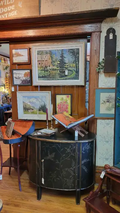 This elegant, pre-owned hand painted black Chinoiserie cabinet brings a sophisticated touch of vinta...