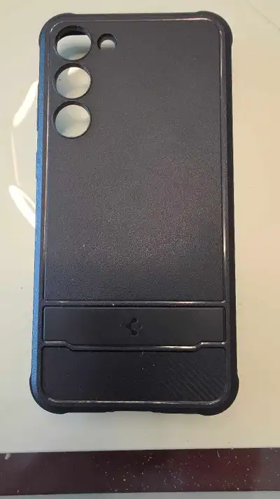 Black Spigen case for Samsung Galaxy S23 plus.