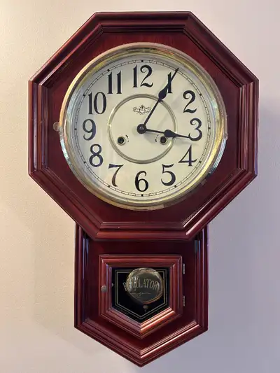 Regulator clock, not antique, approximately 30 years old. Wind up for time and chime. Bongs on the h...
