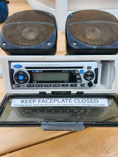 Jensen marine stereo with cd player no bluetooth and speakers mounted on waterproof case with mounti...